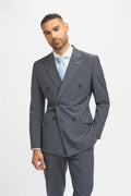 Man wearing a gray suit with a light blue tie on a white background