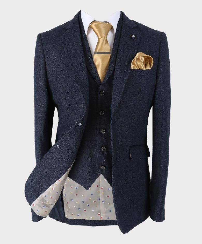 Slim fit light grey herringbone tweed blazer on a man