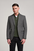 Man in slim fit grey herringbone tweed suit jacket