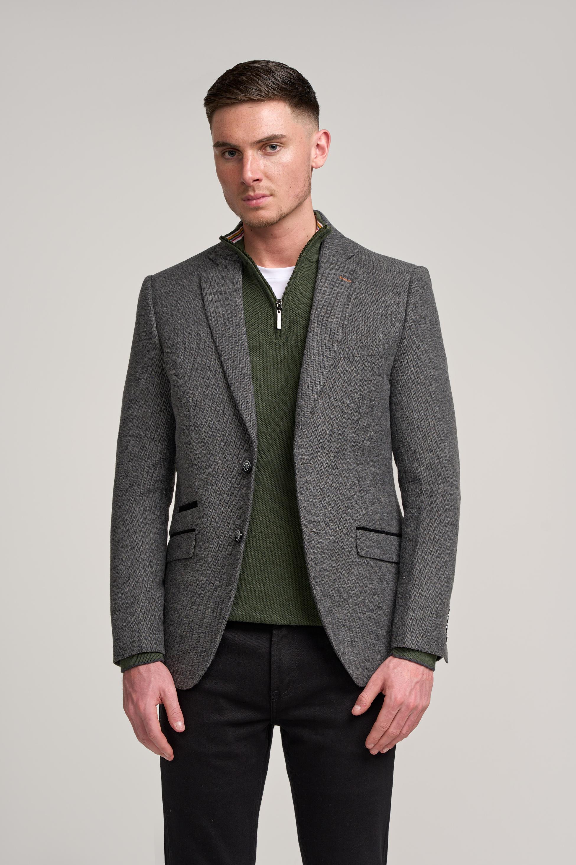 Man in slim fit grey herringbone tweed suit jacket