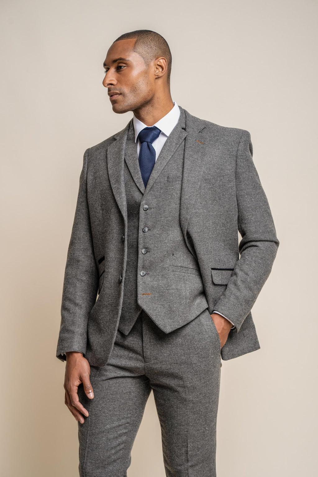 Slim fit charcoal herringbone tweed blazer on male model