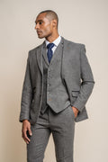Slim fit charcoal herringbone tweed blazer on male model
