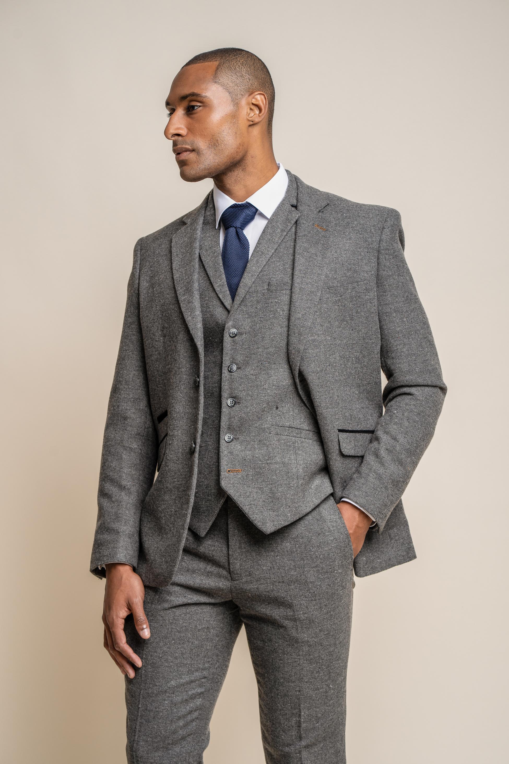 Slim fit charcoal herringbone tweed blazer on male model